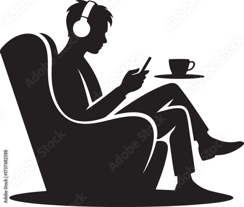 Silhouette of Person Wearing Headphones Using Smartphone in Armchair male sitting
