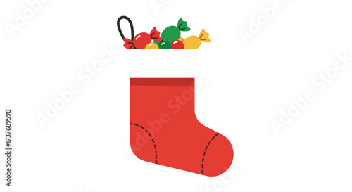 Red Christmas stocking filled with colorful wrapped candies holiday season.