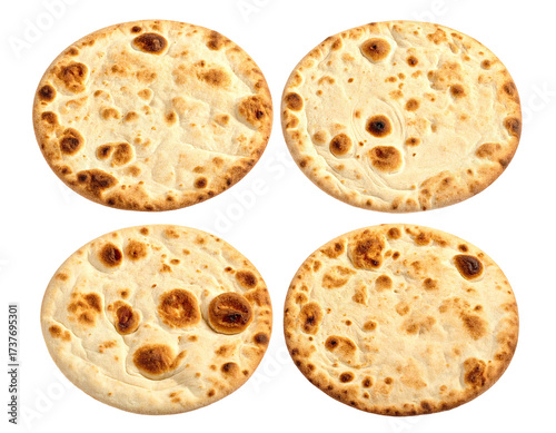 Four golden, round flatbreads with bubbly texture, isolated on black