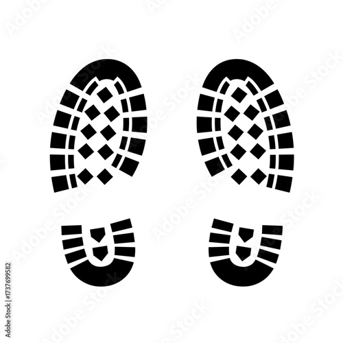 Black shoeprints with tread pattern on white background  