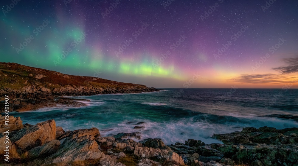 Naklejka premium Aurora Borealis Over Rocky Coastline at Twilight
