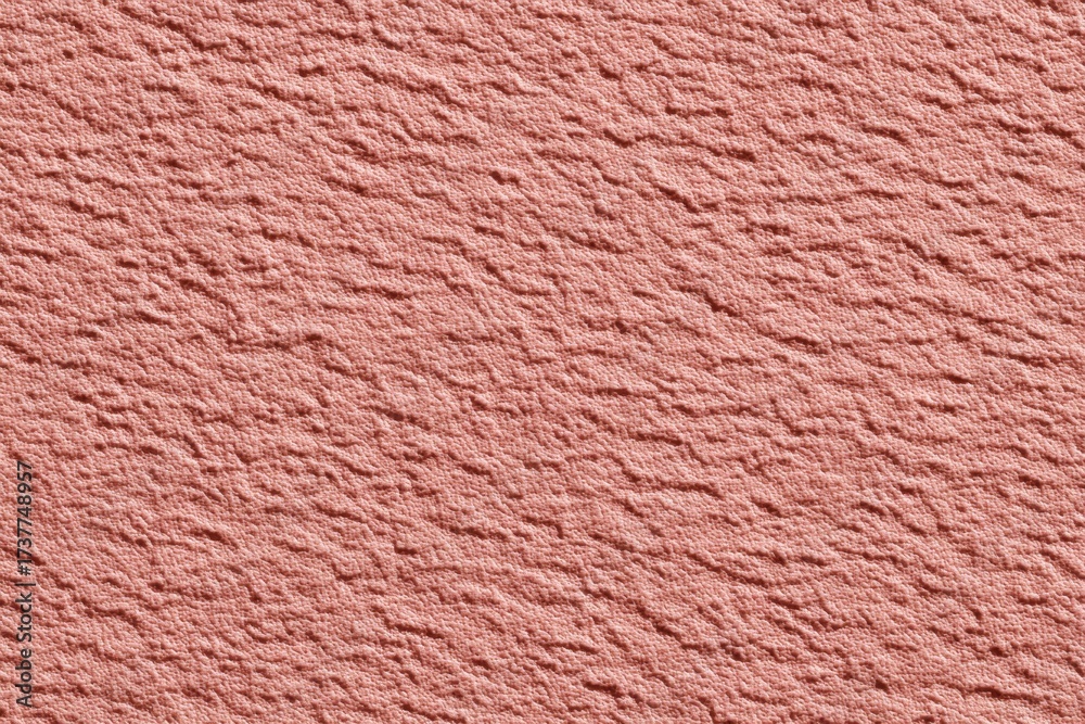 Fototapeta premium Textured pink surface with rough, wrinkled appearance