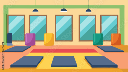 A group exercise room with large mirrors and colorful mats for yoga or aerobics classes.
