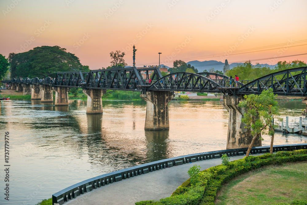Fototapeta premium Sunset landscape with railway bridge on river Kwai, Kanchanaburi, Thailand