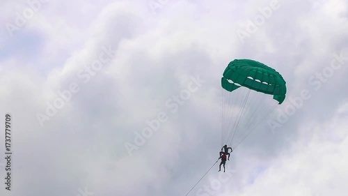 Patong Beach Phuket with turquoise blue water and parasailing Thailand.