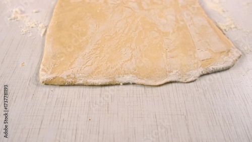 Baker woman hands rolling dough with wooden rolling pin cooking dessert. Create delicious healthy food pastry. Cuisine culinary prepare homemade cook dish domestic meal baking recipe ingredients.