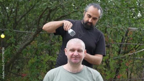 A man has his hair cut with clippers in an outdoor setting. Frame by frame sequence shows the haircut process step by step. Suitable for concepts of transformation, grooming, lifestyle
