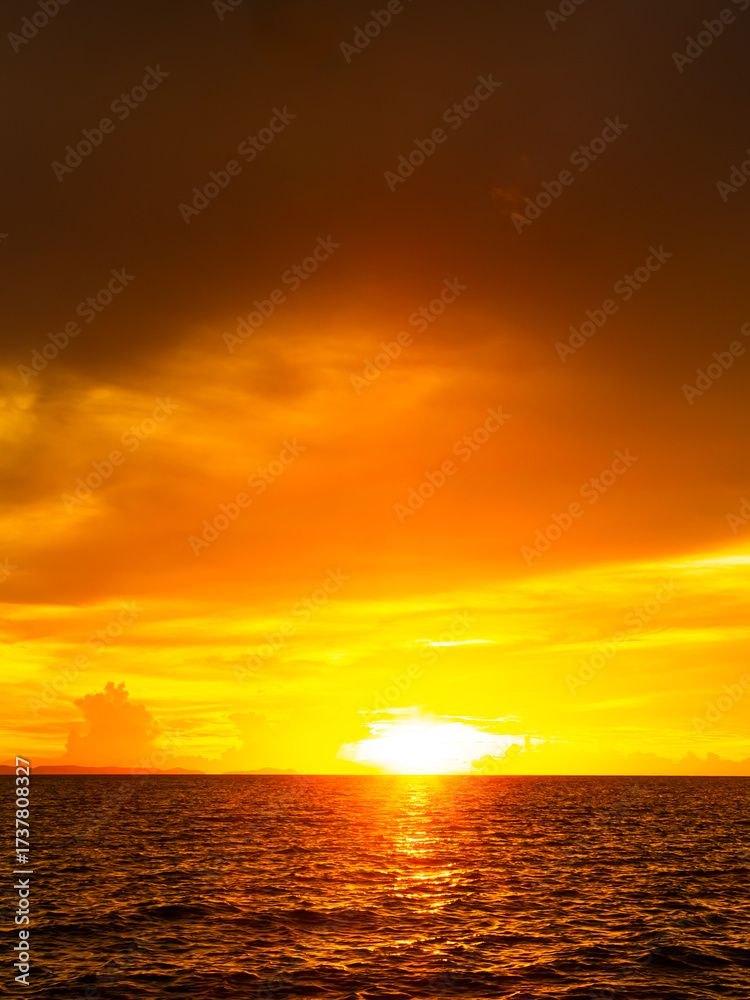 Fototapeta premium Sea sunset sky evening sunrise cloud weather dramatic landscape goldent and indigo color gradient pastel horizon, twilight yellow golden reflection morning nature environment energy ecosystem change.