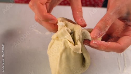 Pastry chef woman cooking dessert wrapping filled pear in dough on kitchen. Create delicious healthy food pastry. Cuisine culinary prepare homemade cook domestic meal baking recipe ingredients.