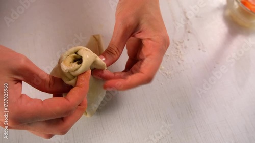 Pastry chef woman cooking dessert wrapping filled pear in dough on kitchen. Create delicious healthy food pastry. Cuisine culinary prepare homemade cook domestic meal baking recipe ingredients.