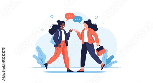 Two young women are talking to each other while walking and smiling.