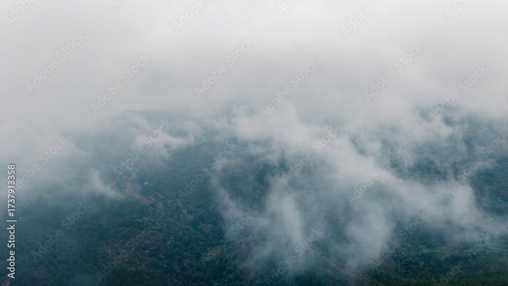 Fototapeta premium Aerial view of mountains in autumn mist