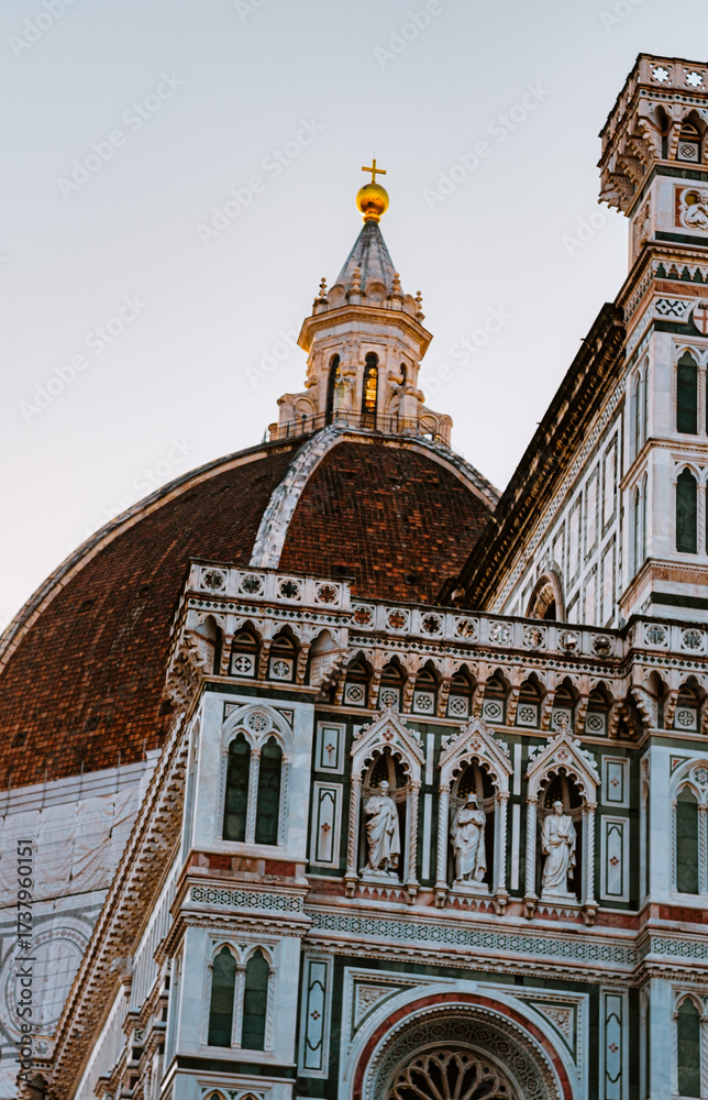 Naklejka premium Florence. Italy - 09.06.2025: Close-up view of the historic Florence Cathedral, Santa Maria del Fiore, showcasing Brunelleschi's iconic dome and the intricate marble facade.