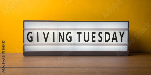 Giving Tuesday message on lightbox with yellow background  