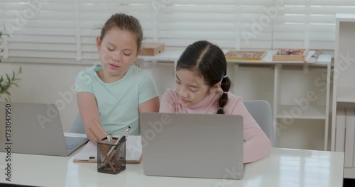 two girl study online on the laptop in the classroom 4k video.