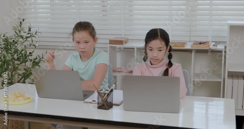 two girl study online on the laptop in the classroom 4k video.