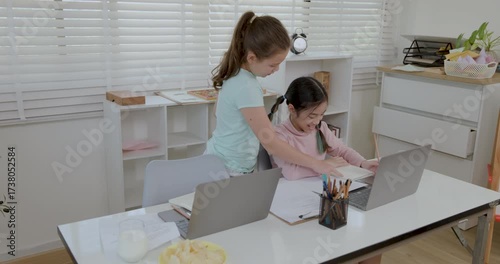 two girl study online on the laptop in the classroom 4k video.