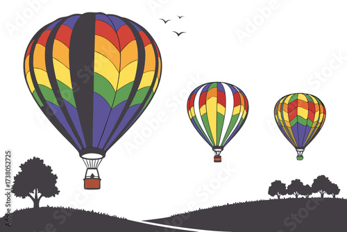 Three colorful hot air balloons over silhouetted landscape