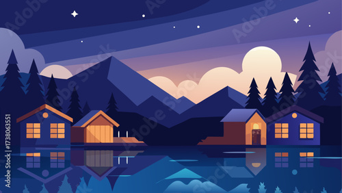 Houses at lakeside with mountains at night