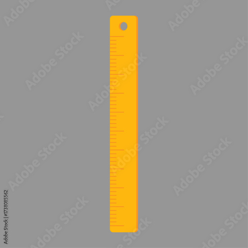 Simple yellow ruler with measurement markings isolated on a neutral gray background, perfect for educational or design projects
