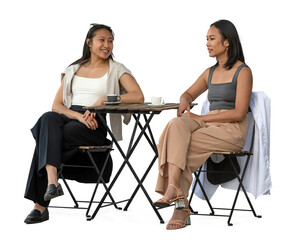 Two young Vietnamese women sitting in a cafeteria and talking, isolated on white and transparent background