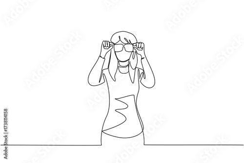 Single continuous line drawing woman dressed as a nerd, holding glasses with large frames. The most unique and ridiculous in the office. Attractive. Geek Pride Day. One line design vector illustration