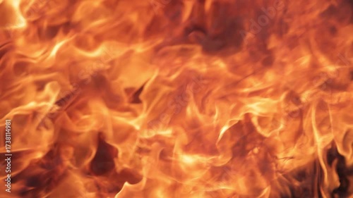 Close-up of raging flames captured in the aftermath of a fire, symbolizing destruction, danger, disaster, and the devastating impact of uncontrolled burning.