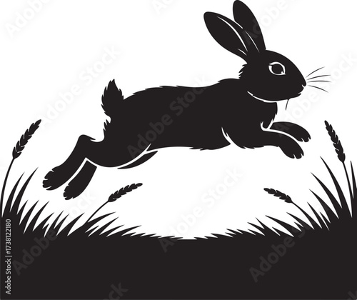 Silhouette of a Jumping Bunny in a field: A monochrome image captures a dynamic bunny in mid-leap over the grasses. Demonstrating graceful movement of a bunny.