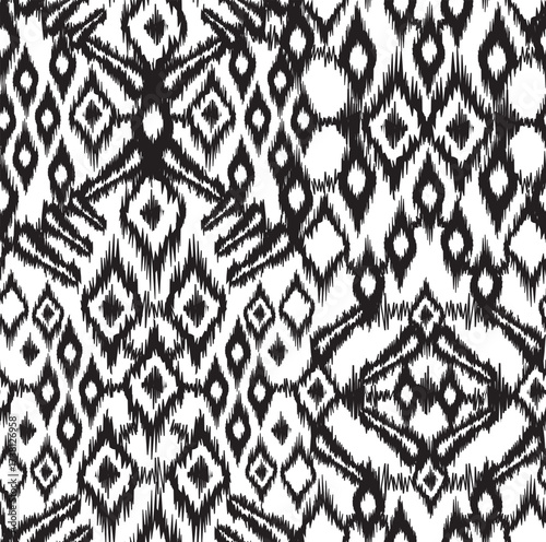 Seamless monochromatic ikat pattern. Repeating vector print with an ethnic black motif design on a white background. Apparel textile pattern. 