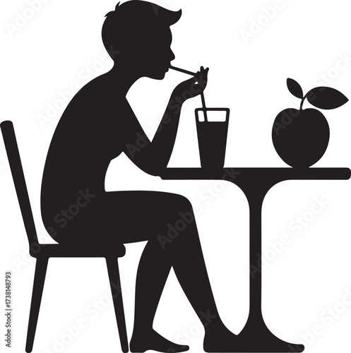 Silhouette of a person sitting at a table drinking from a glass with a straw and an apple on the table