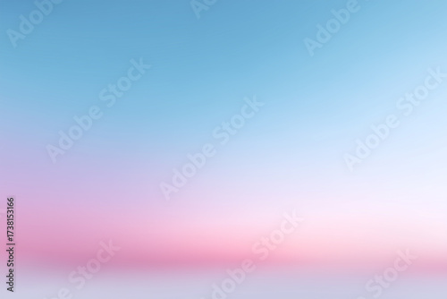 Bright hues blend in a tranquil sunset sky over calm waters