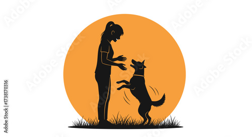 Woman training her dog outside during sunset in silhouette.