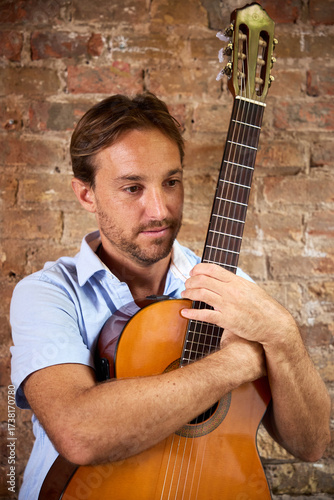 sad man with guitar