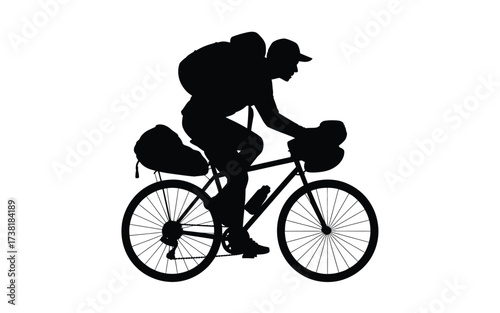 Silhouette of a cyclist with backpack on a bicycle adventure