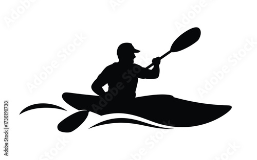 Silhouette of a kayaker paddling through water waves