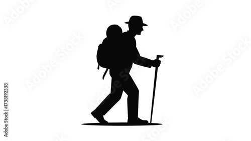 Silhouette of a hiker with backpack and walking stick traveling