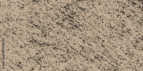 Close-up of a rough, natural stone wall texture with brown and sand colored rock for a textured background and surface pattern