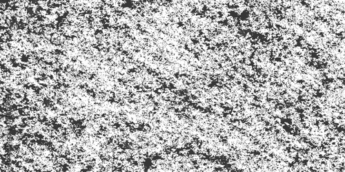 Black and white textured granite rock surface with a rough grunge pattern for a concrete wall backgrounds