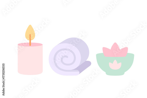 Spa relaxation elements with burning candle, neatly rolled towel, and serene lotus flower bowl