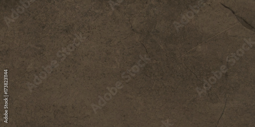 Textured of brown concrete wall surface with natural cracks and weathered stone patterns for architectural backgrounds.