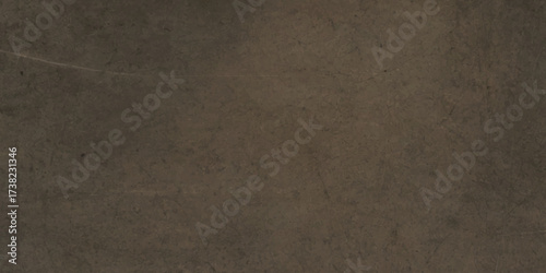Textured of brown concrete wall surface with natural cracks and weathered stone patterns for architectural backgrounds.