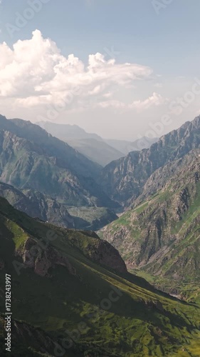 Aerial view of mountains and valley near Stepantsminda village in Georgia. Vertical video
