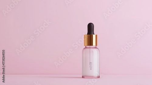 Wallpaper Mural A sleek dropper bottle stands against a soft pink background, showcasing a minimalist design ideal for skincare or cosmetic products. Torontodigital.ca