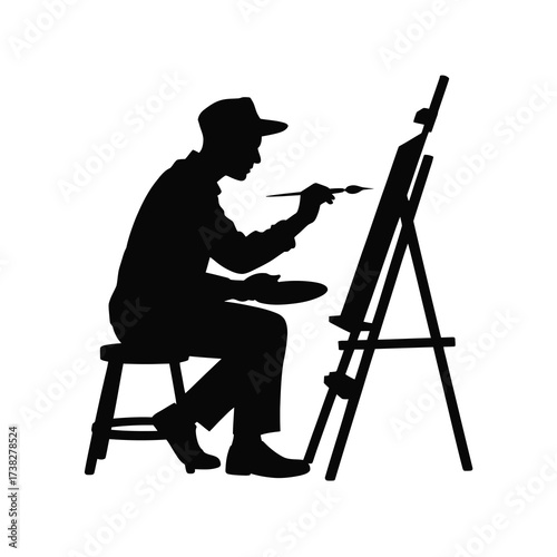 Artistic silhouette of a painter at an easel creating a masterpiece