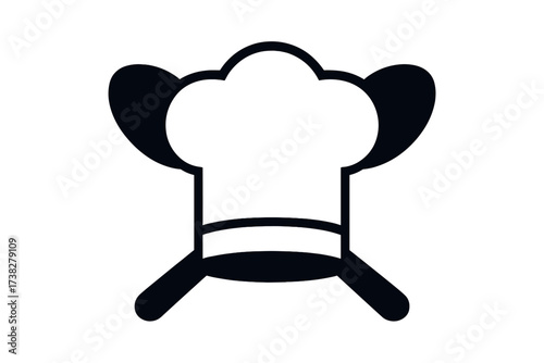 Professional chef hat and crossed kitchen spatulas, a symbol for cooking and cuisine