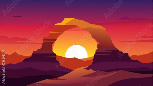 As the sun sets the rock arch takes on a new life glowing orange and red in the fading light.