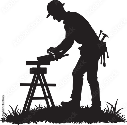 Silhouette carpenter working on wood at sawhorse worker