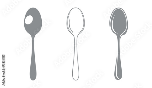 Three gray spoons in a row on a white background cutlery utensil