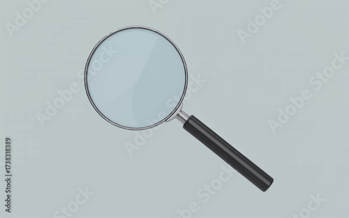 A black handled magnifying glass with a silver rim on a light gray background lens zoom