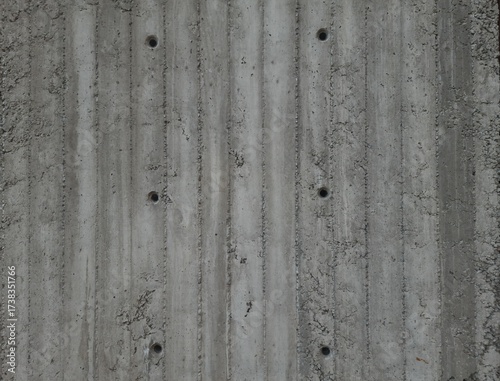 фотографія Gray cement wall background with holes
